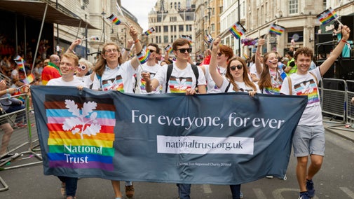 National Trust staff and volunteers walking in the parade at London Pride, July 2022